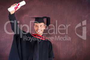 Composite image of happy attractive boy after his graduation