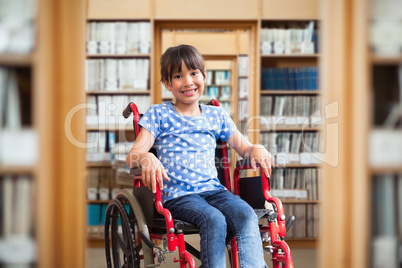 Composite image of cute disabled pupil smiling at camera in hall