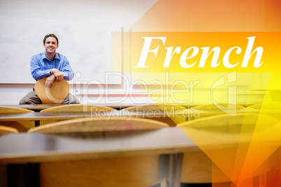 French against male teacher sitting on chair in lecture hall