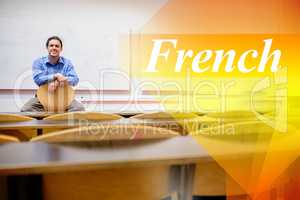 French against male teacher sitting on chair in lecture hall