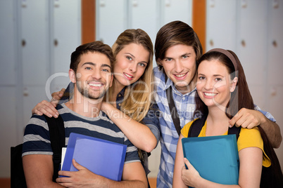Composite image of students holding folders at college corridor