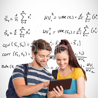 Composite image of happy students using tablet pc