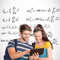 Composite image of happy students using tablet pc