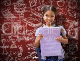 Composite image of cute pupil smiling at camera holding notepad