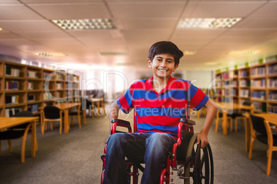 Composite image of boy sitting in wheelchair in school corridor