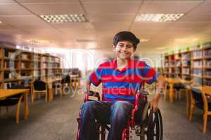 Composite image of boy sitting in wheelchair in school corridor