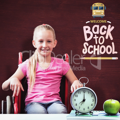 Composite image of cute disabled pupil smiling at camera in hall