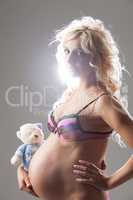 Young Pregnant Woman With A Toy