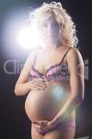 Young Pregnant Woman In A Lingerie