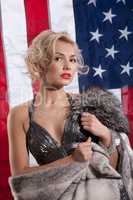 Young Woman In Fur Coat And American Flag