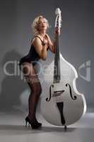 Young Woman In Lingerie With A Double Bass