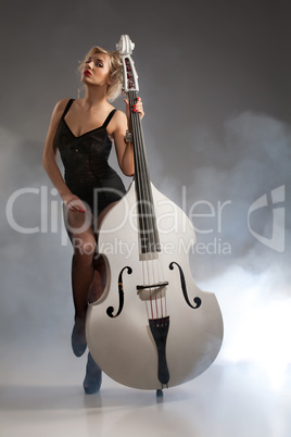 Young Woman In Lingerie With A Double Bass