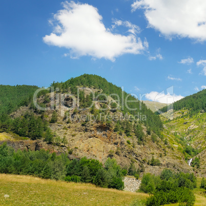 scenic mountains, meadows and blue sky