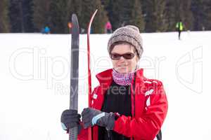 Woman with cross-country skiing in winter landscape