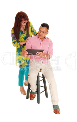 Couple looking at there tablet computer.