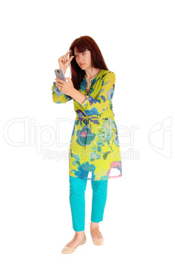 Businesswoman looking at cell phone. Businesswoman looking at cell phone.