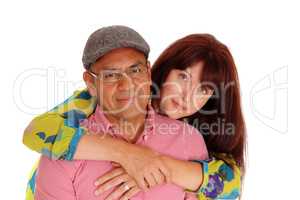 Caucasian wife hugging her man.