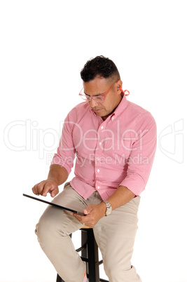 Man working with his tablet computer.