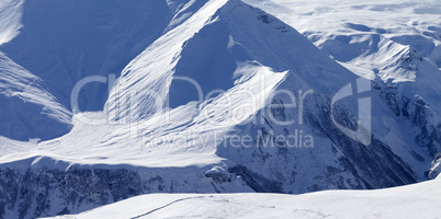Snow off-piste slope in high mountains