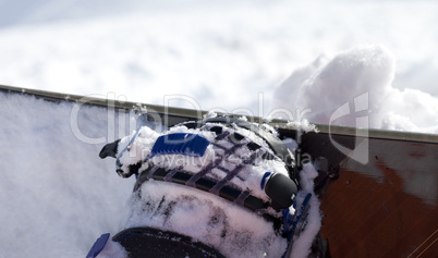 Snowboard and boot in binding on off-piste slope