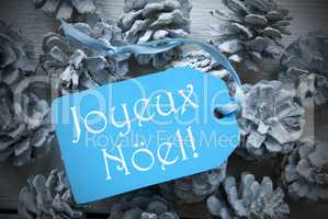 Blue Label On Fir Cones Joyeux Noel Means Merry Christmas