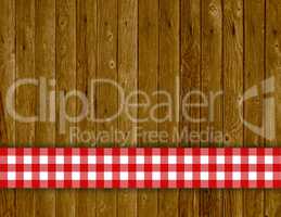 Rustikaler Holz Hintergrund mit rot weisser Tischdecke