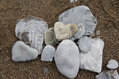 Heart shaped stone on beach Heart shaped stone on beach