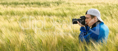Photographer in a field of barley