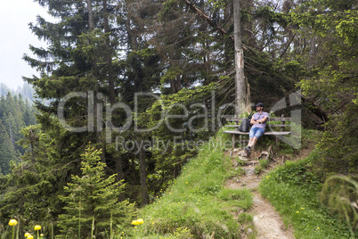 Hiker takes a break and enjoys the view