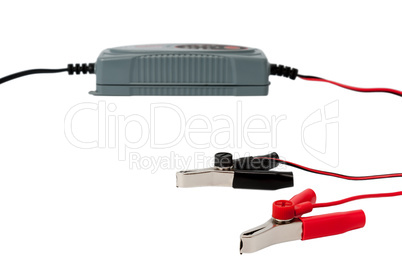 Modern electronic charger for car battery with clamps