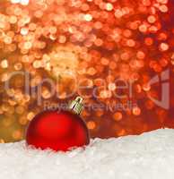 Red christmas ball on the defocused background
