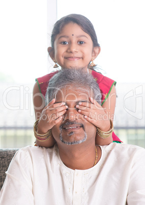 Daughter playing with father