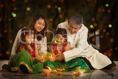 Indian family celebrating Diwali, fesitval of lights