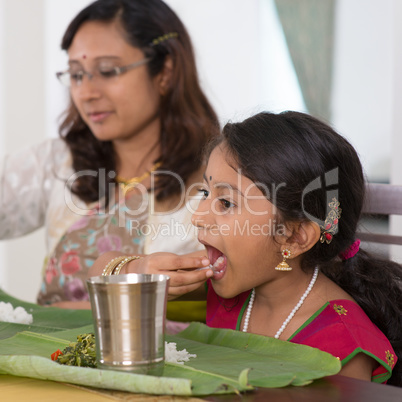 Indian family eating dinner at home