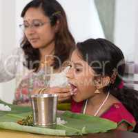 Indian family eating dinner at home