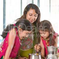 Mother cooking in kitchen