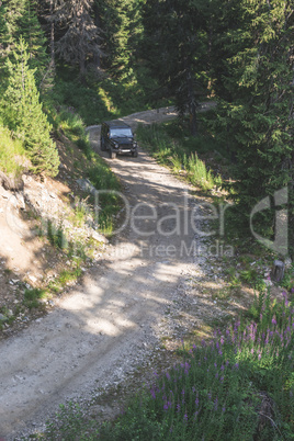 Offroad car on a mountain road