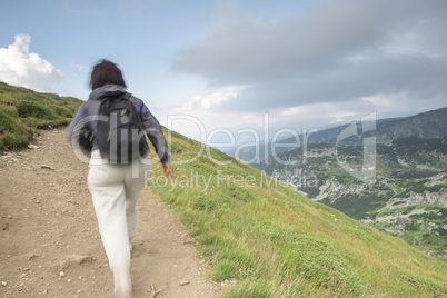 Senior woman walking in the mountain