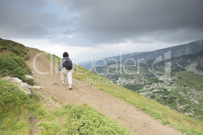 Senior woman walking in the mountain