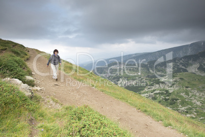 Senior woman walking in the mountain