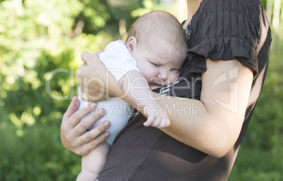 Baby in his mother's arms