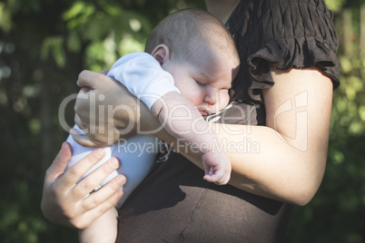 Baby in his mother's arms