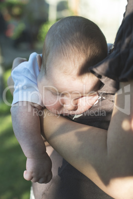 Baby in his mother's arms