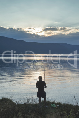 Silhouette of fisherman