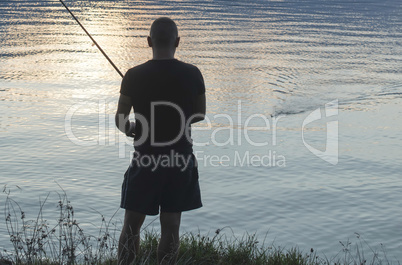 Silhouette of fisherman