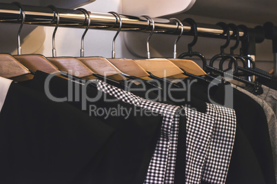 Clothes on hangers in shop