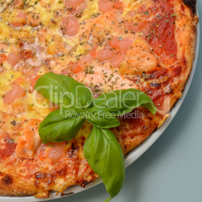 Pizza with salmon and shrimps