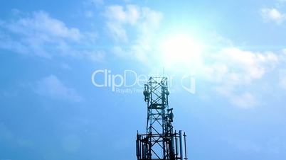 Sun and clouds with network tower