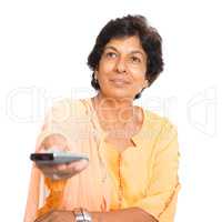 Indian mature woman watching tv