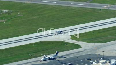 Propeller aircraft taking off from Billy Bishop Toronto City Airport